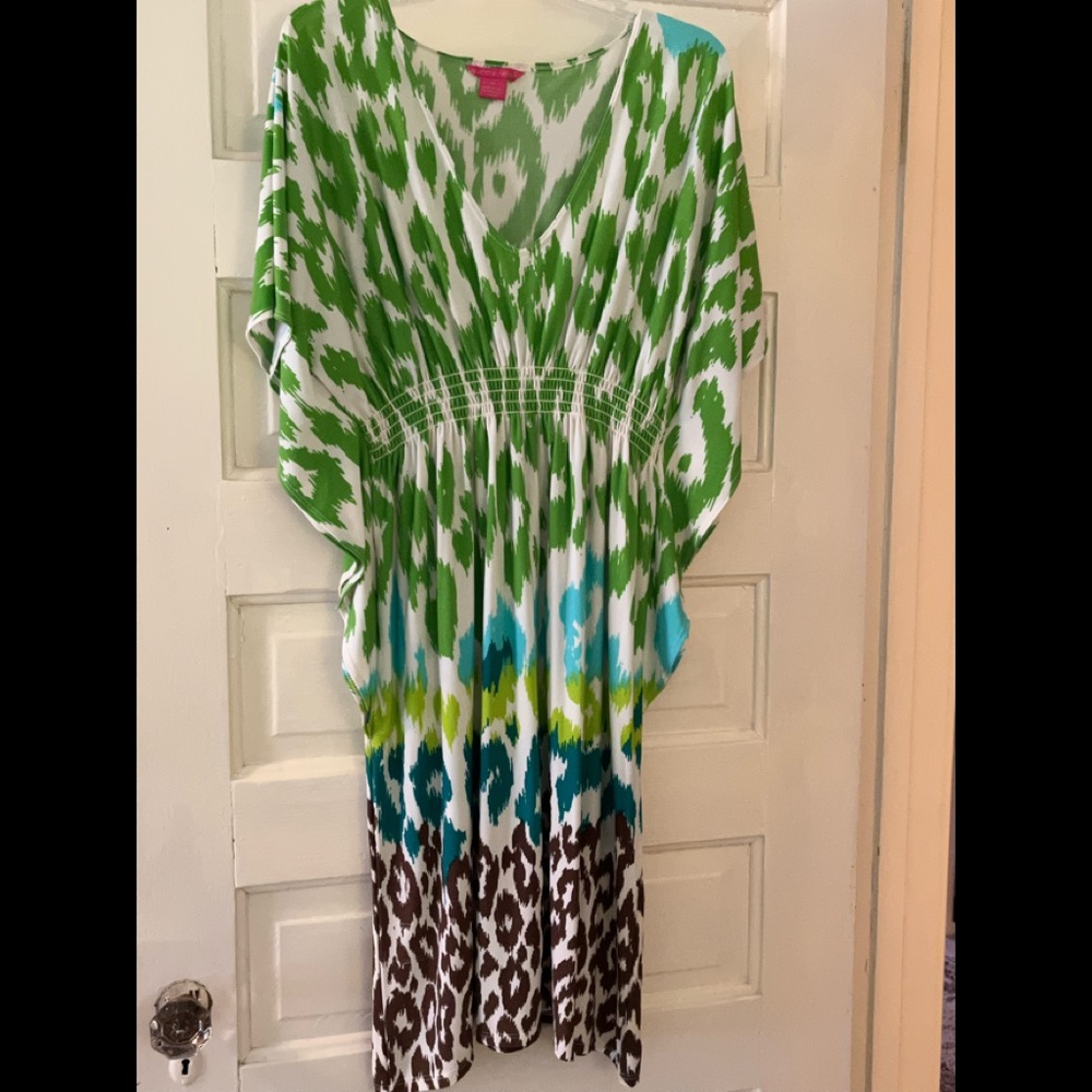 Sunny Leigh size medium dress. Has an elastic waist and “winged” sides. So cute